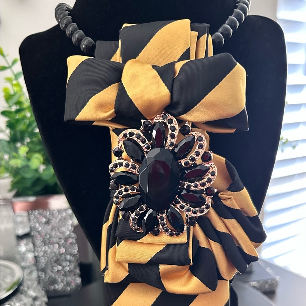Black and Gold Striped Ribbon Necklace with Black Gem Brooch